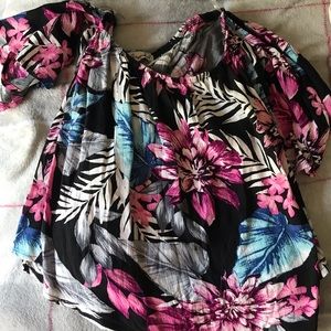 Off the shoulder floral shirt.